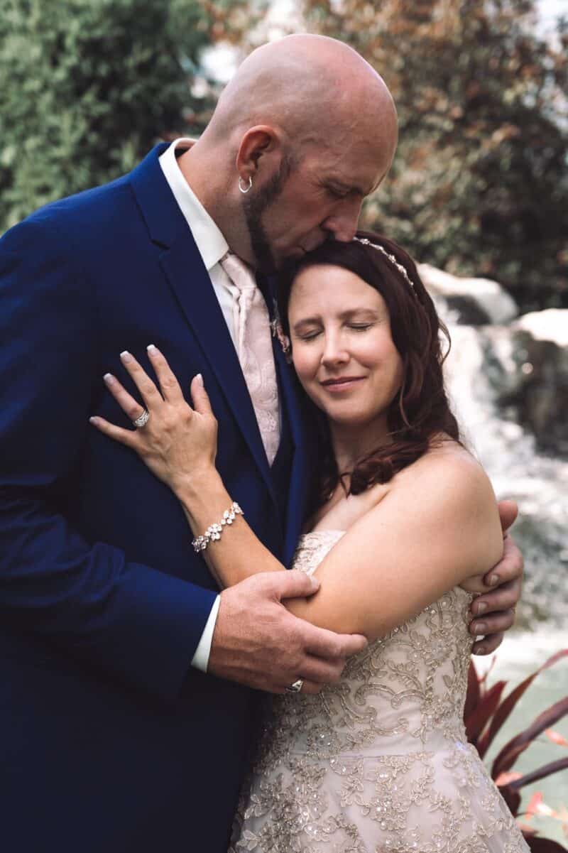 wedding couple by waterfall